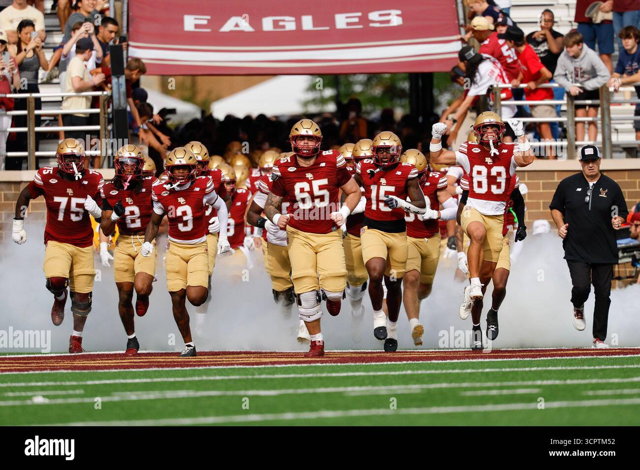Boston College offensive lineman Logan Taylor (65) leads the team onto ...