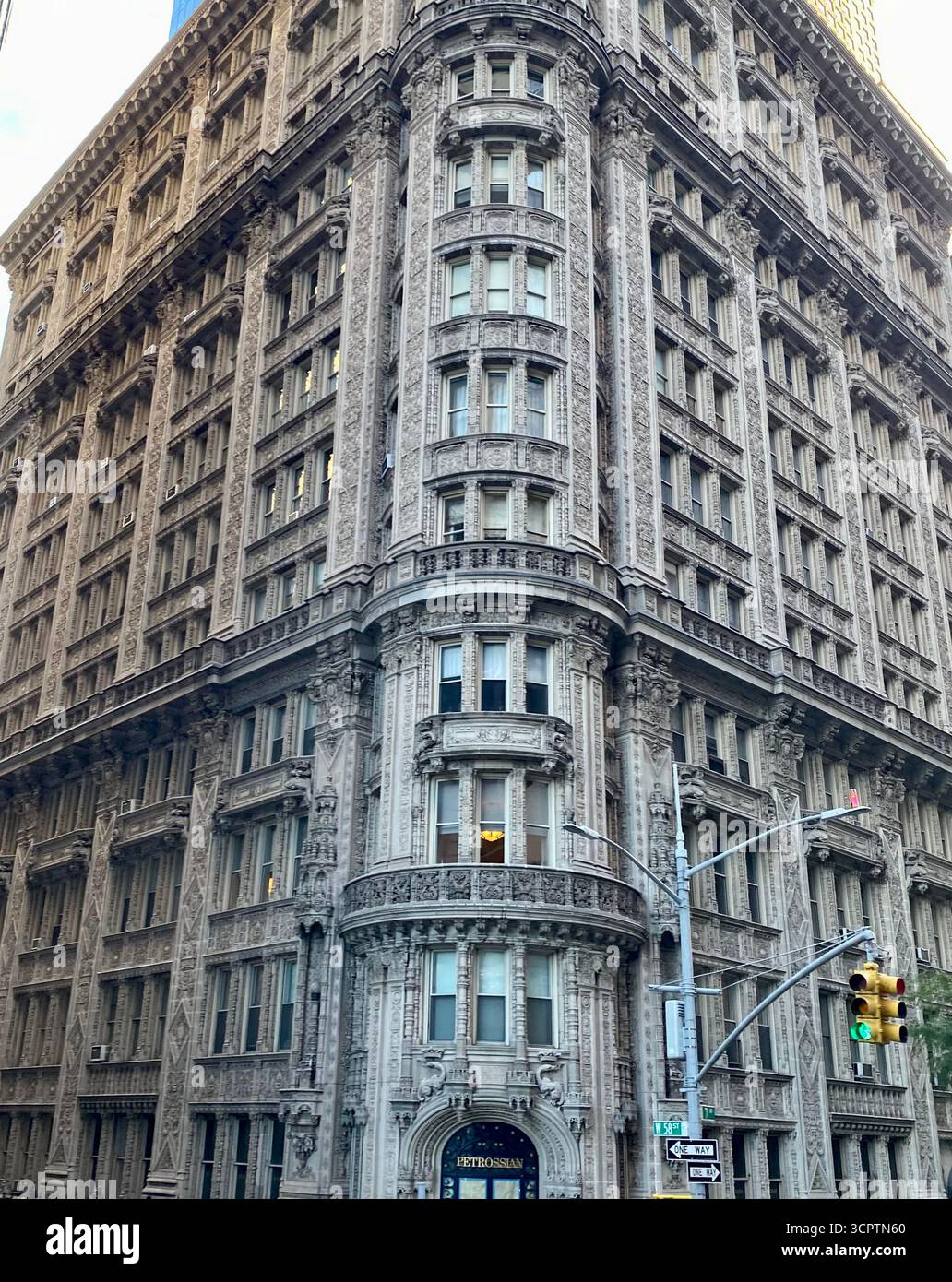 Historic Stone Building with Ornate Facade on Urban Street Corner in New York City - Smartphone Captured Stock Image