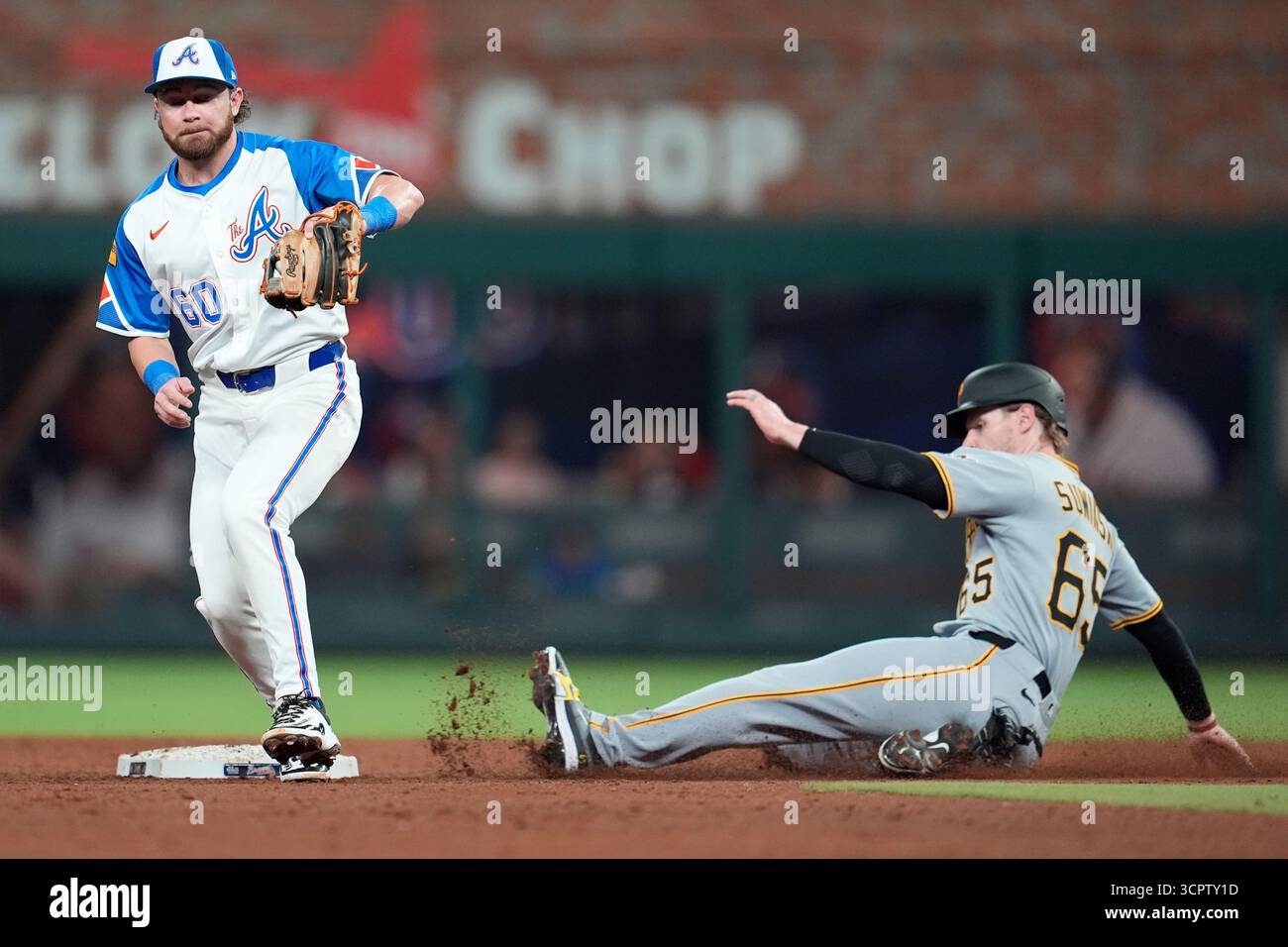 Pittsburgh Pirates' Jack Suwinski (65) slides safe in the second ...
