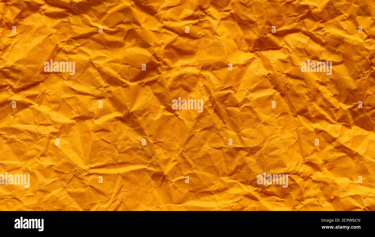 Crumpled Orange Paper Texture with Dimensional Folded Surface Stock Photo