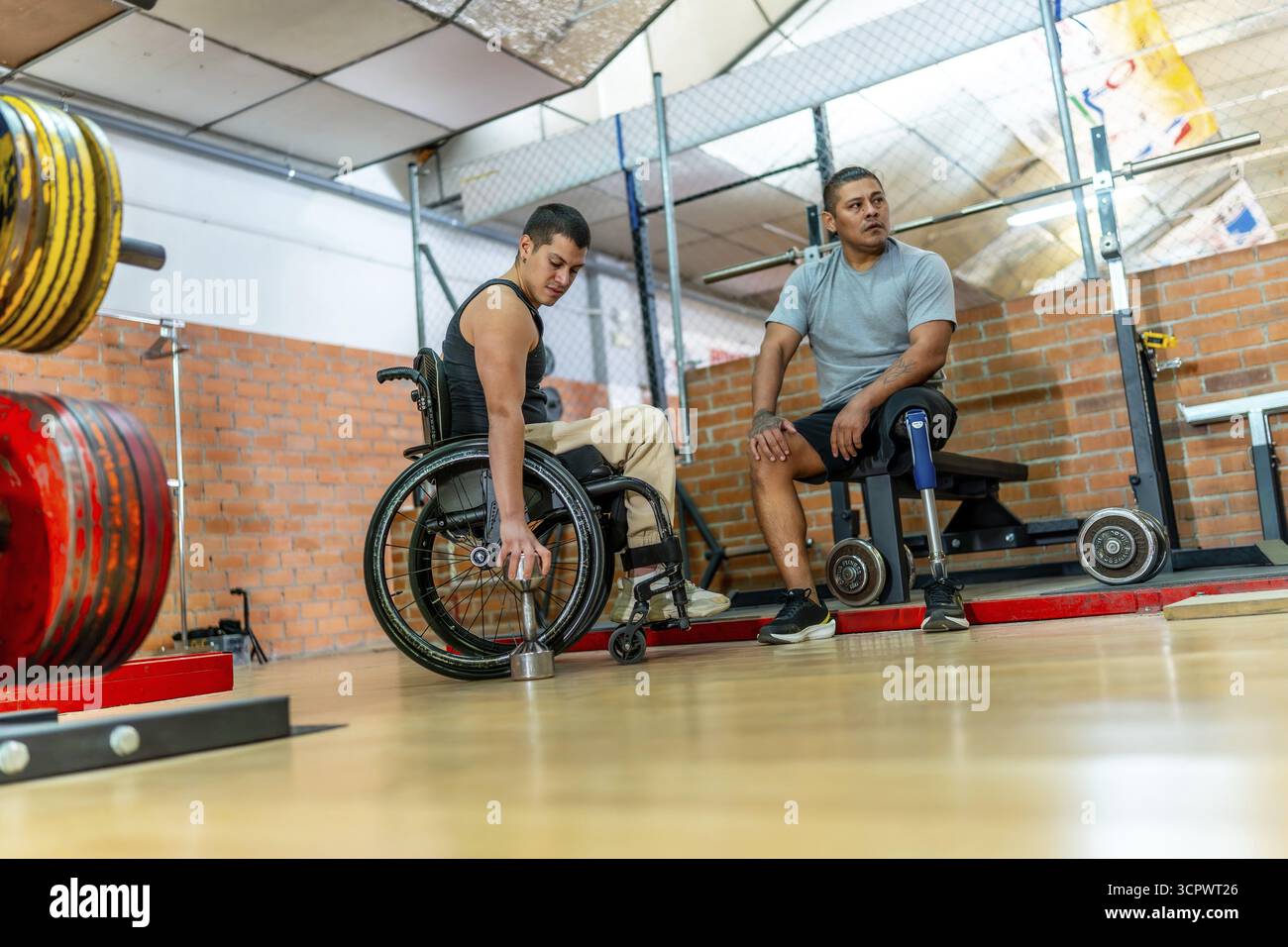 Adaptive athletes with physical disabilities engaging in training at a ...