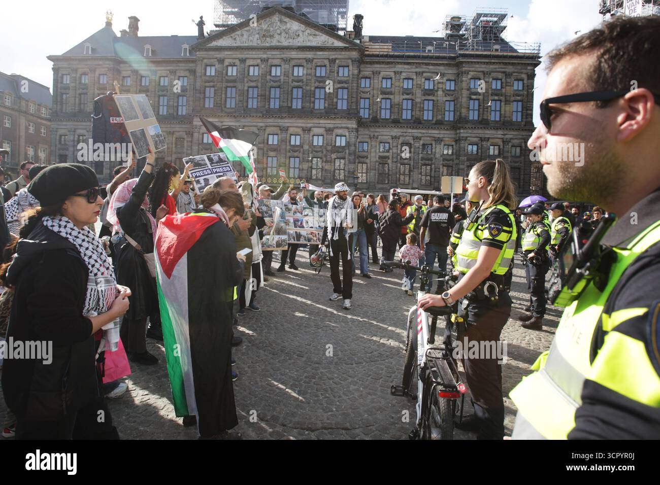 AMSTERDAM, NETHERLANDS - SEPTEMBER 28: Police stand back pro-Palestine ...