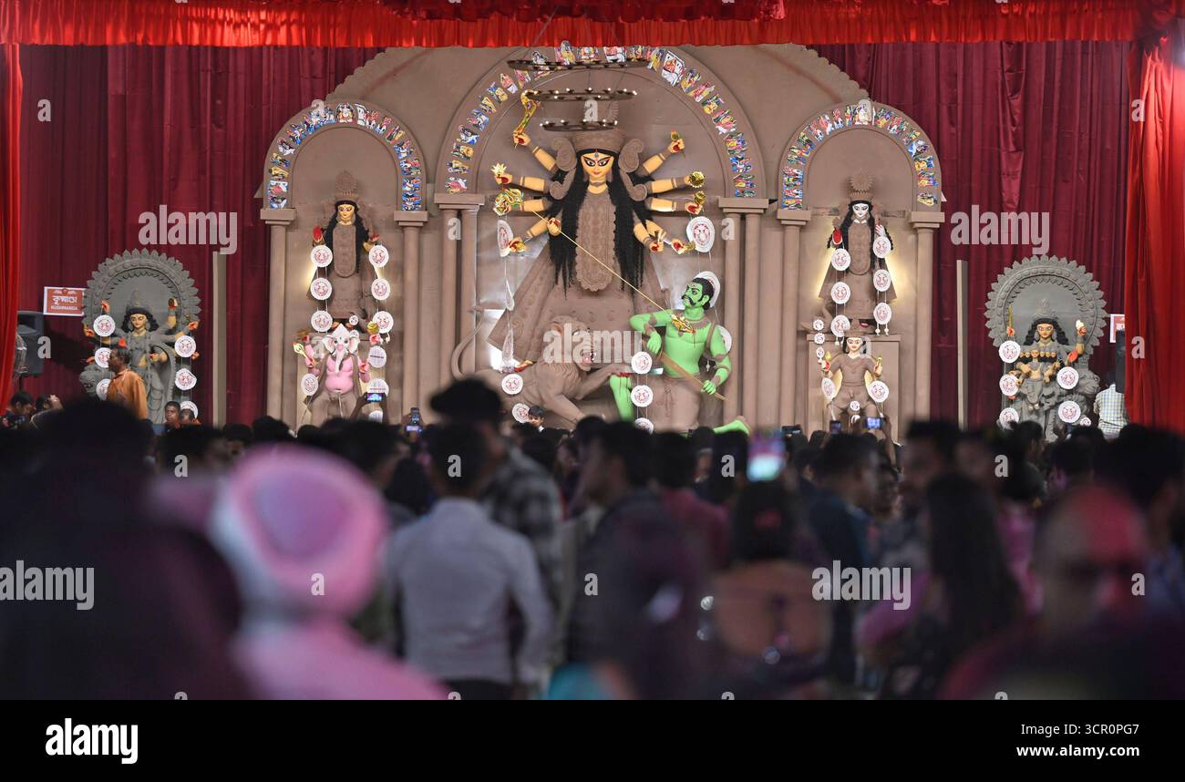 Durga R C NEW DELHI, INDIA - SEPTEMBER 28: Devotees in front of the goddess Durga ...