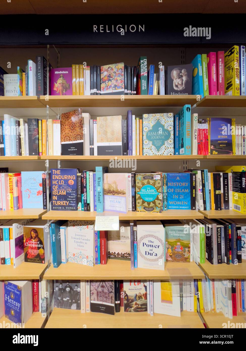 Shelves of Books on Religion for sale at the bookstore - Smartphone Captured Stock Image
