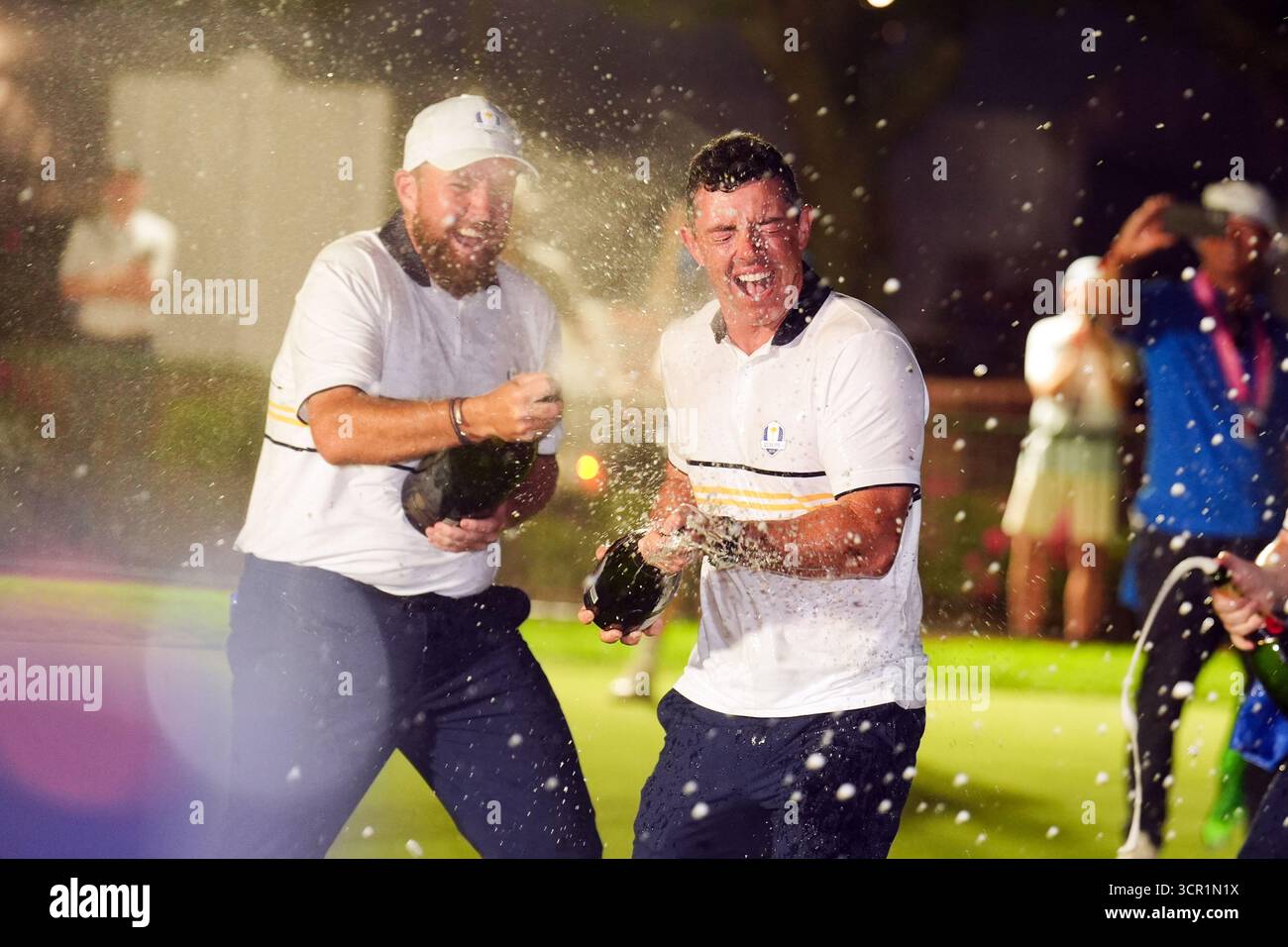 Rory McIlroy and Shane Lowry of Team Europe celebrate after winning the ...