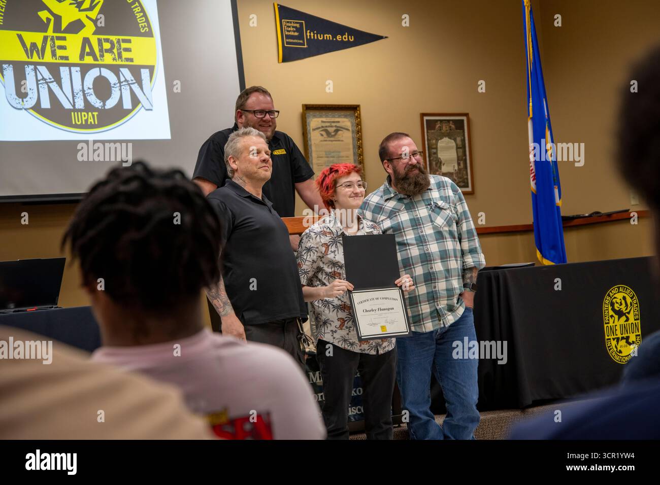 Little Canada, Minnesota. Student showing diploma to the graduating class at the Finishing Trades Academy which is a unique opportunity for high schoo Stock Photo