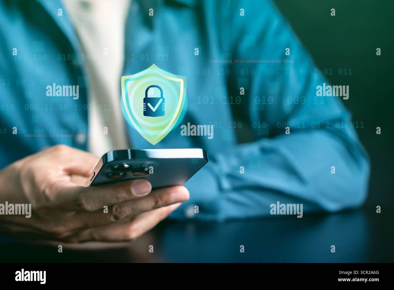 Cybersecurity and mobile data protection concept. Smartphone with digital shield and lock, online Stock Photo