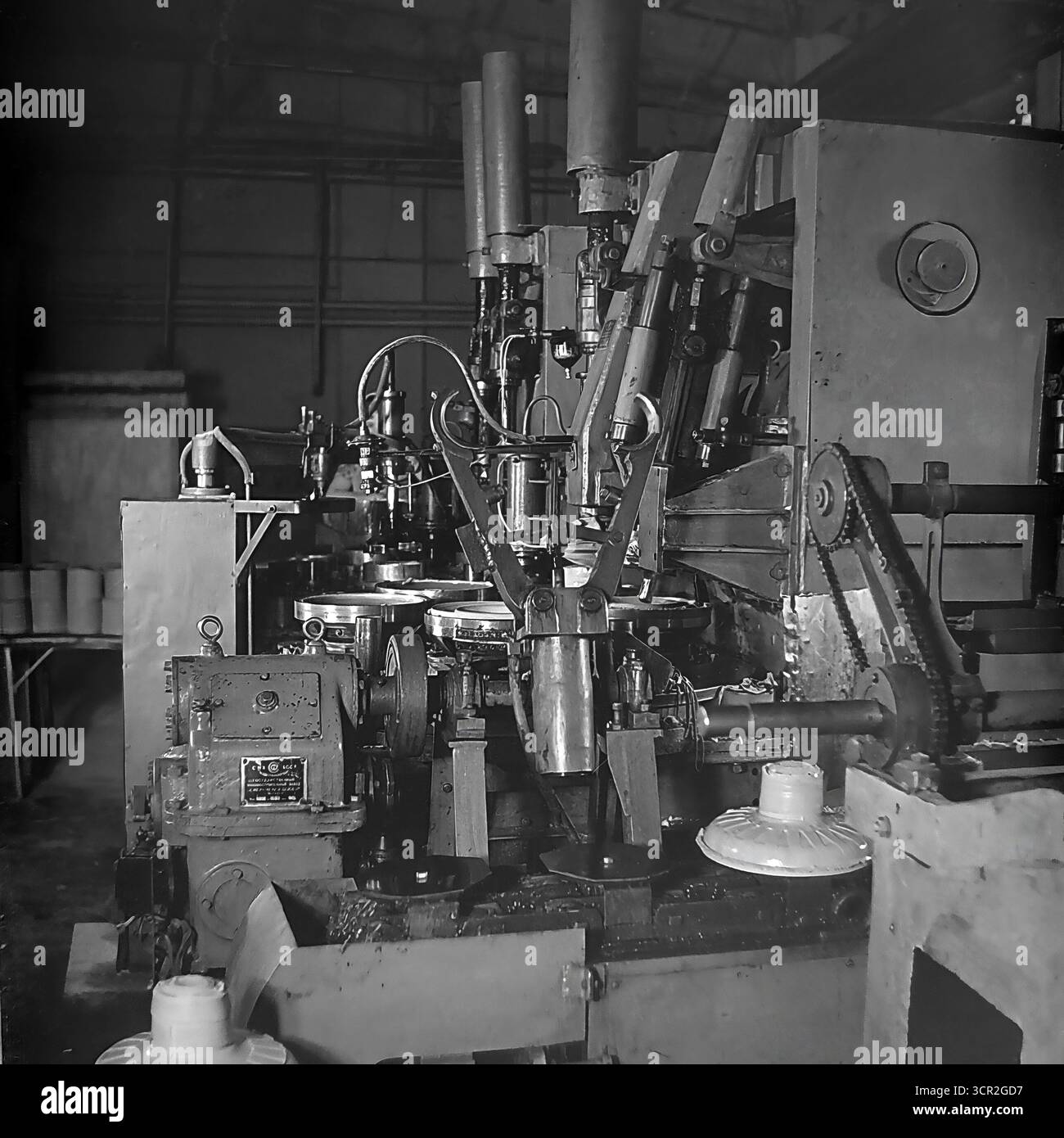 A complex automated multi-station rotary machine with mechanical arms ...