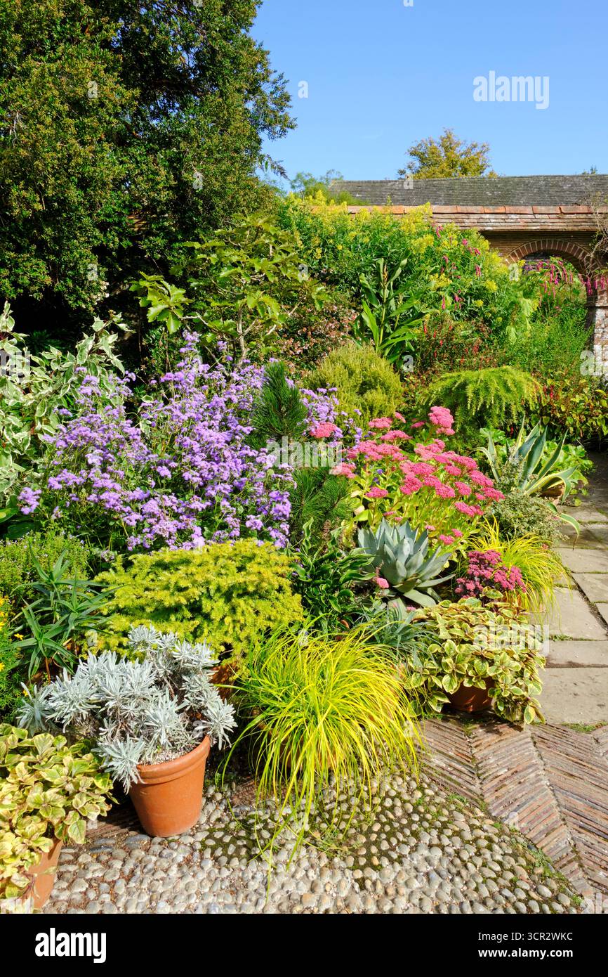 Patio pots at Great Dixter walled garden, East Sussex, UK Stock Photo