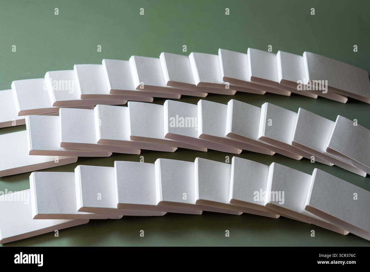 Blank white rectangular objects on green surface Stock Photo