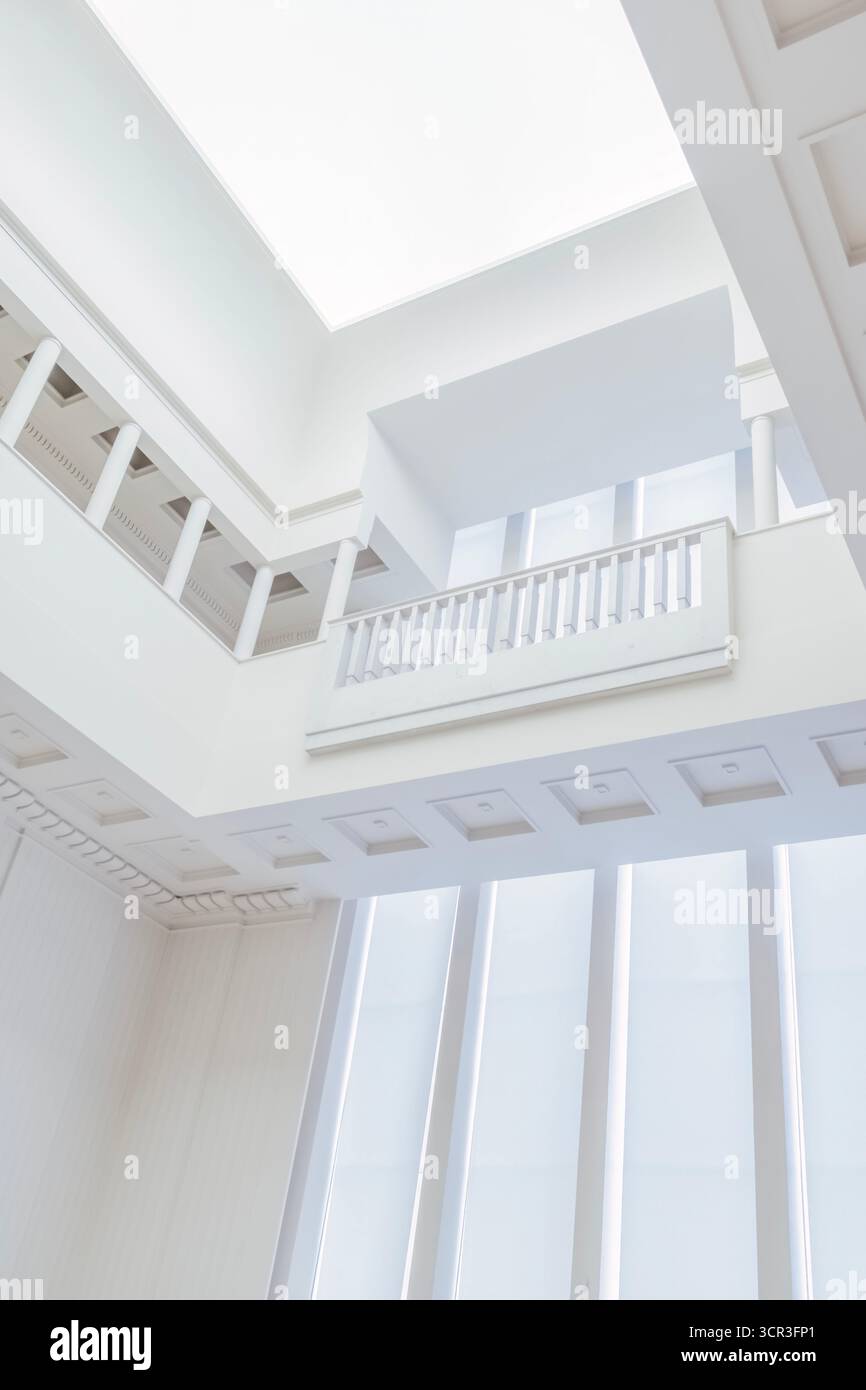 Architectural detail of the Hall or Gallery inside the historical Art Deco Serralves Villa, featuring white columns, a balustrade, skylight, Porto Stock Photo