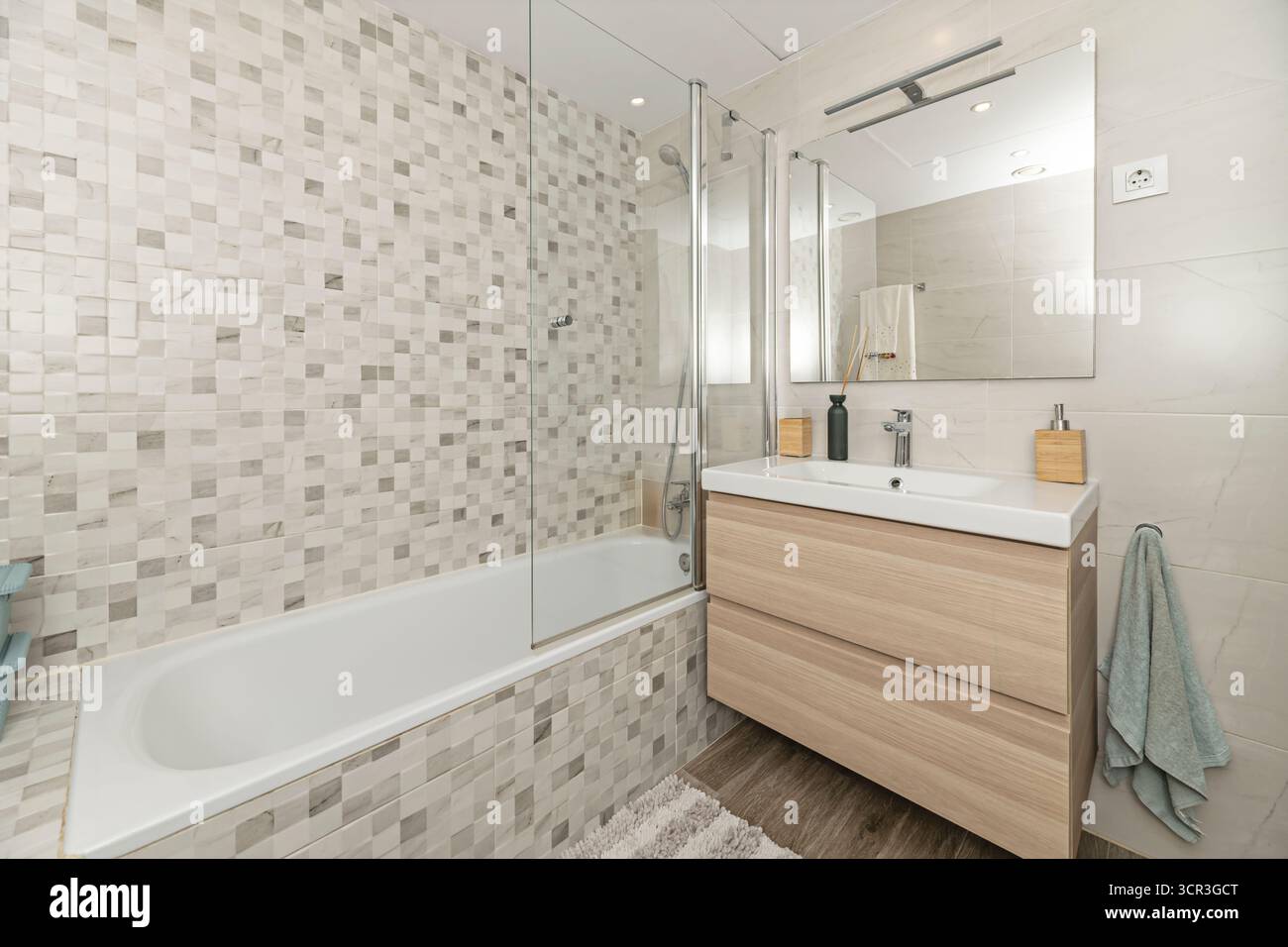 Contemporary bathroom with hexagonal wall tiles, a floor-standing ...