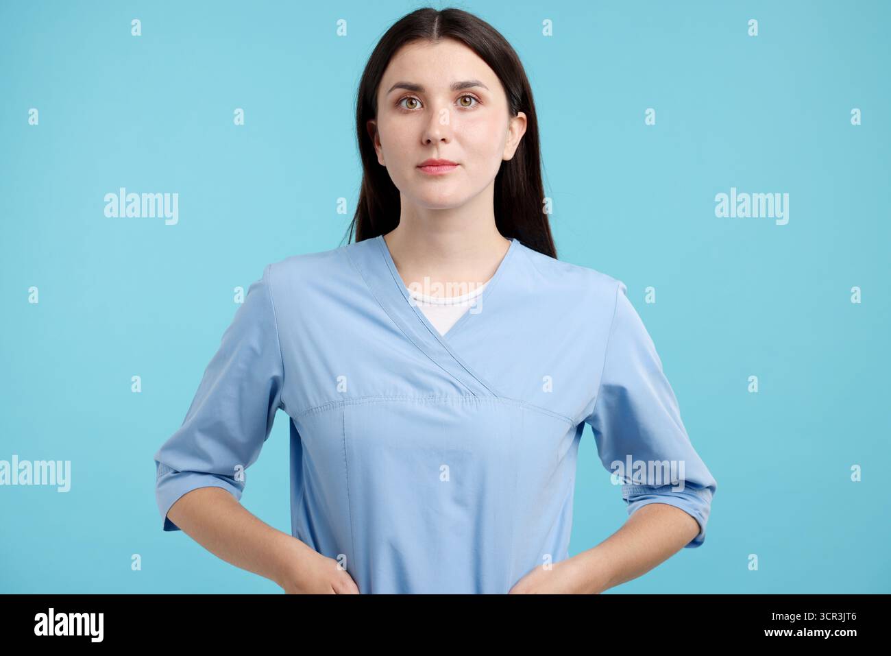 Young caregiver in blue scrubs hi-res stock photography and images - Alamy