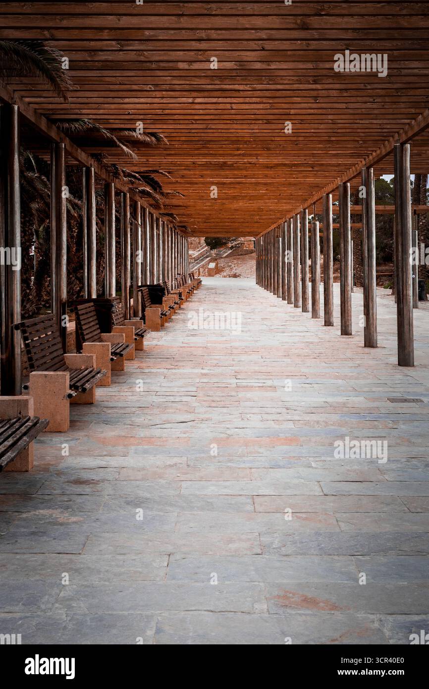 Covered Path Rustic Covered wooden walkway with benches in rustic architectural design ...