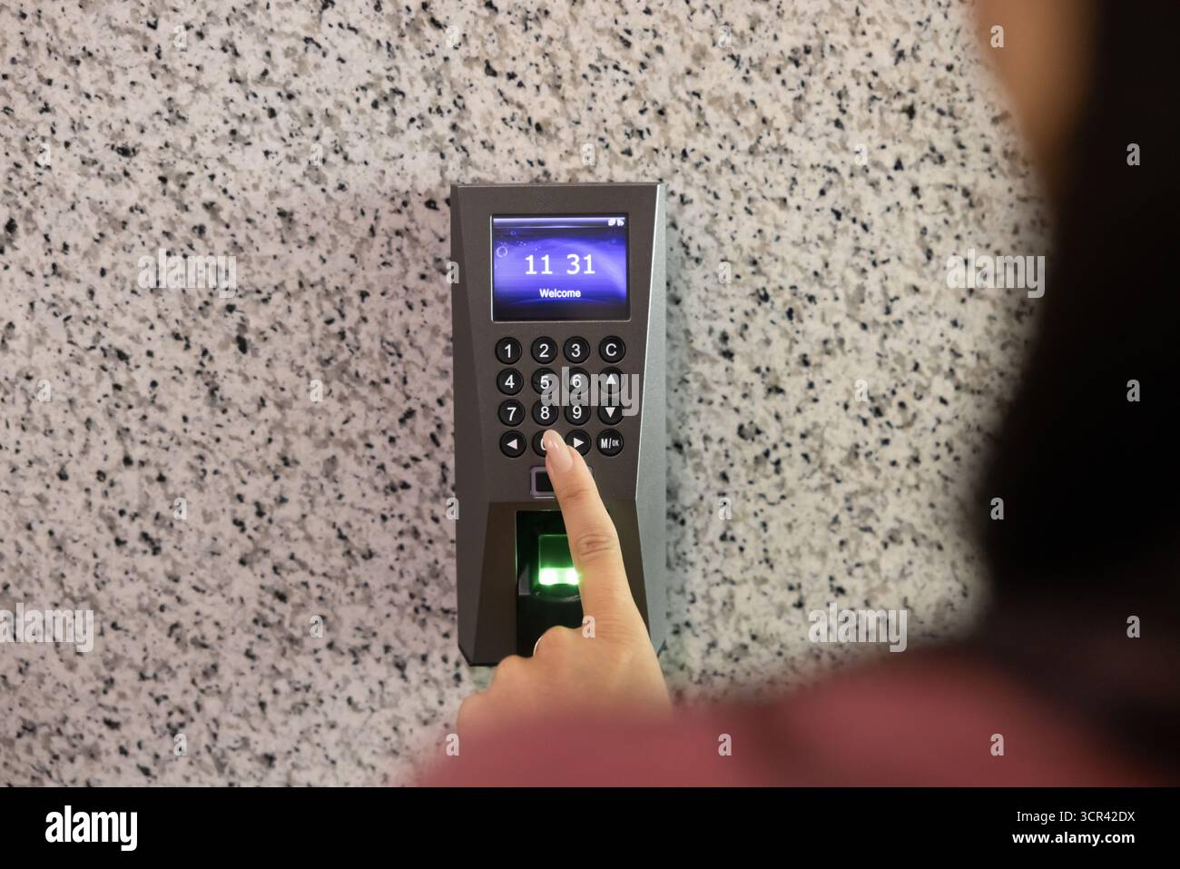 Woman entering office room using keyless access system Stock Photo