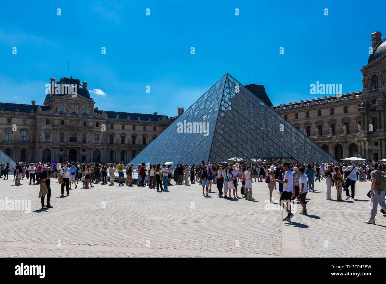 Louvre Museum with is iconic glass pyramid, is a national art museum in ...