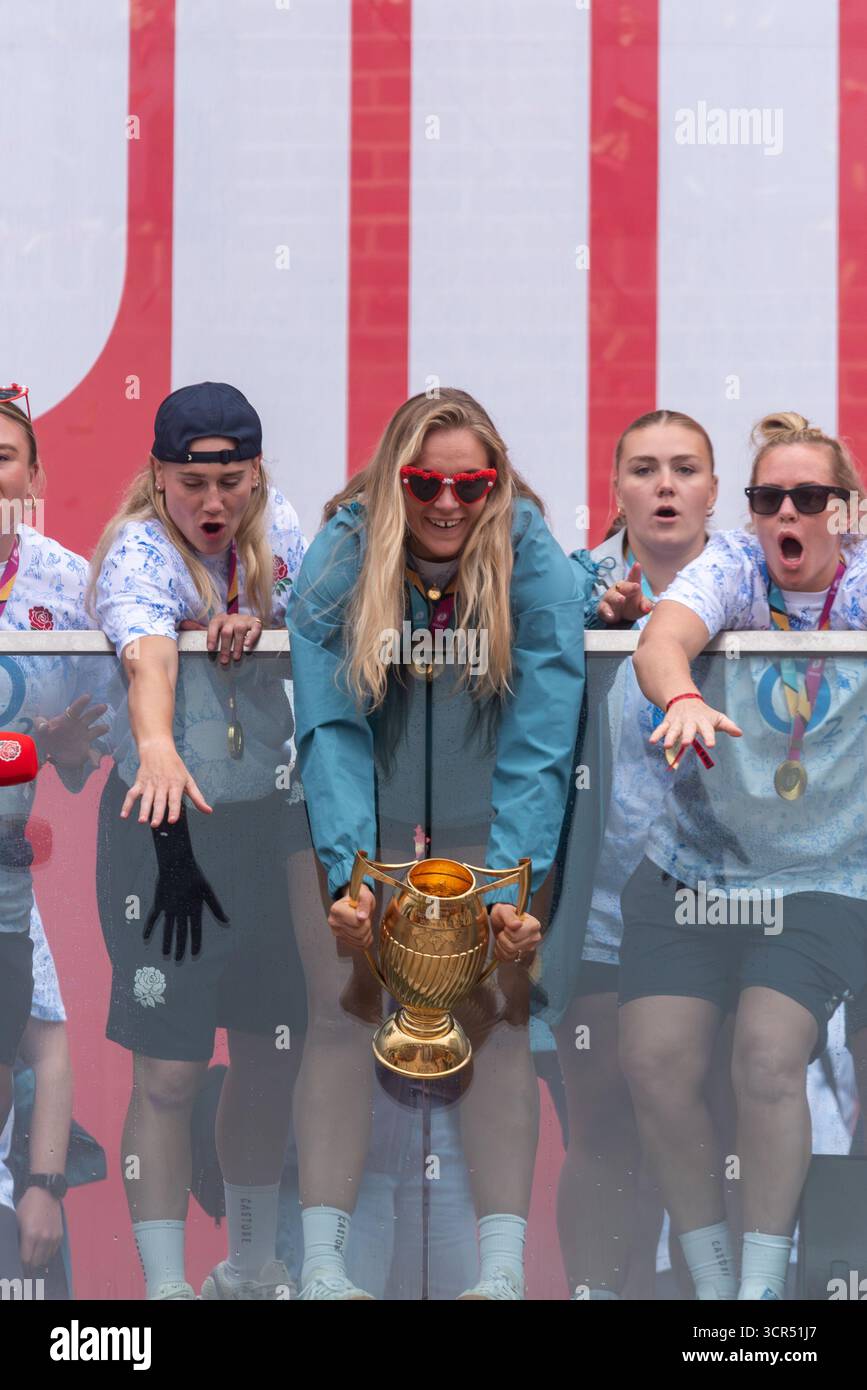 Zoe Aldcroft with trophy & England women's rugby team players celebrating at the Red Roses Champions Party, Battersea, after winning World Cup Stock Photo