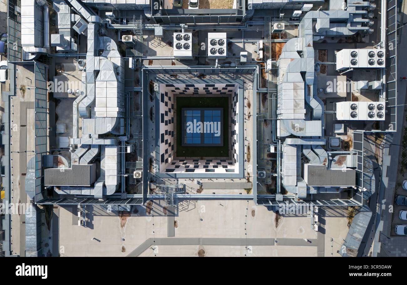 Aerial view of a building's intricate rooftop mechanical systems ...