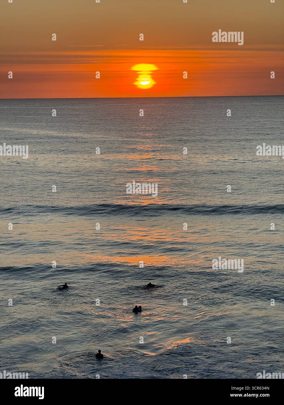 Sunset and Surfers, Widemouth Bay, Cornwall - Smartphone Captured Stock Image