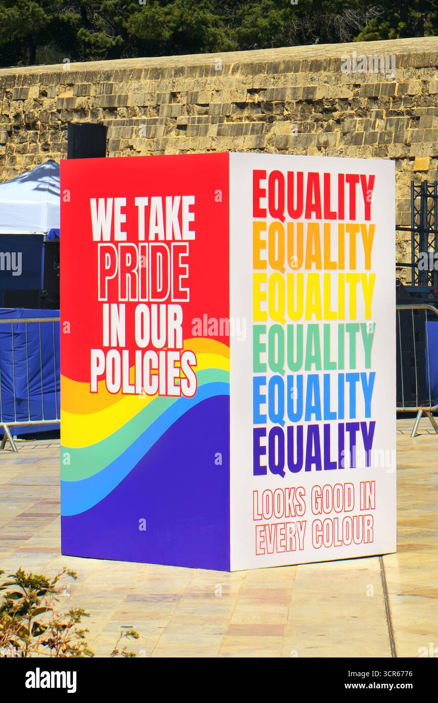 A colorful pride and equality display promoting inclusive policies with rainbow colors at an outdoor event. Stock Photo