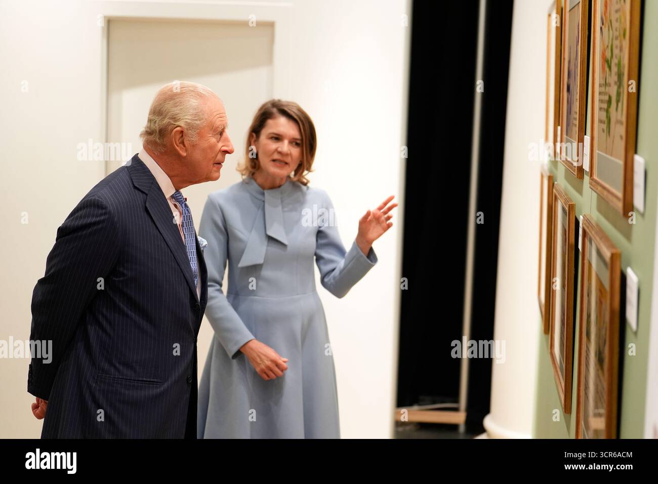 King Charles III with Aura Woodward, director of the Romanian Cultural Institute in London, during a visit to view the Queen Marie of Romania exhibition at the Garrison Chapel in London. Picture date: Monday September 29, 2025. Stock Photo