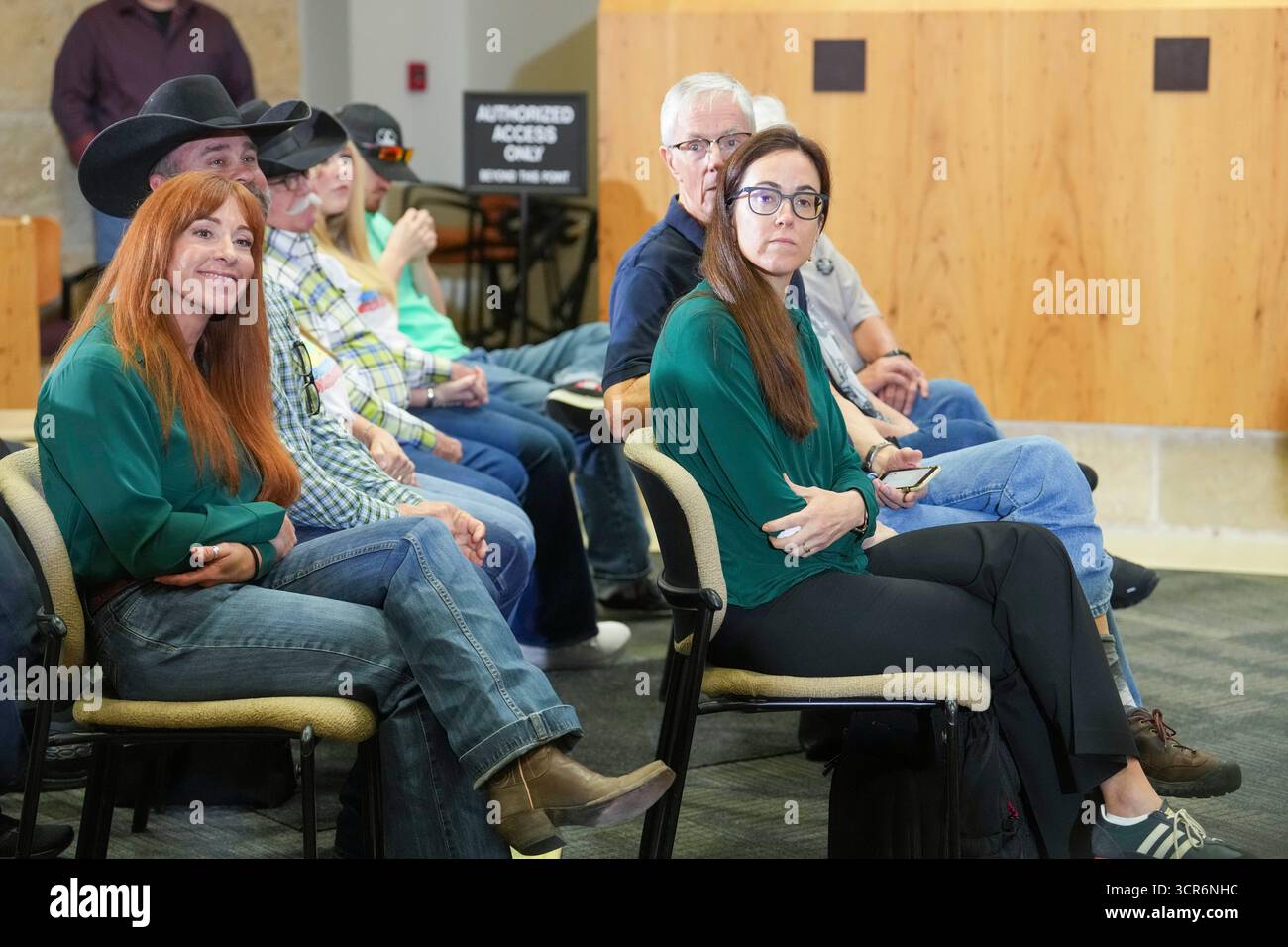 Austin, Texas, USA. 29 Sept, 2025. Family members of the four slain girls listen and applaud as Austin, Texas police announce they've solved the 34-year old Austin Yogurt Shop murder case where four teenage girls were slain at the I Can't Believe It's Yogurt shop on December 6, 1991. The four victims, Amy Ayers, Jennifer Harbison, sister Sarah Harbison and Eliza Thomas, were found bound, gagged and set on fire. New DNA evidence points to serial killer Robert Eugene Brashers as the suspect. Credit: Bob Daemmrich/Alamy Live News Stock Photo