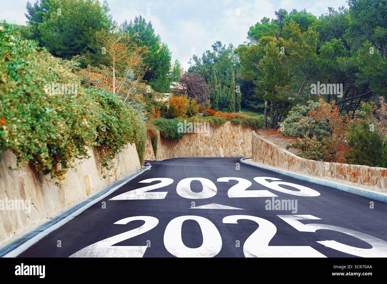 Road leading into the future with the years 2025 and 2026 painted on ...