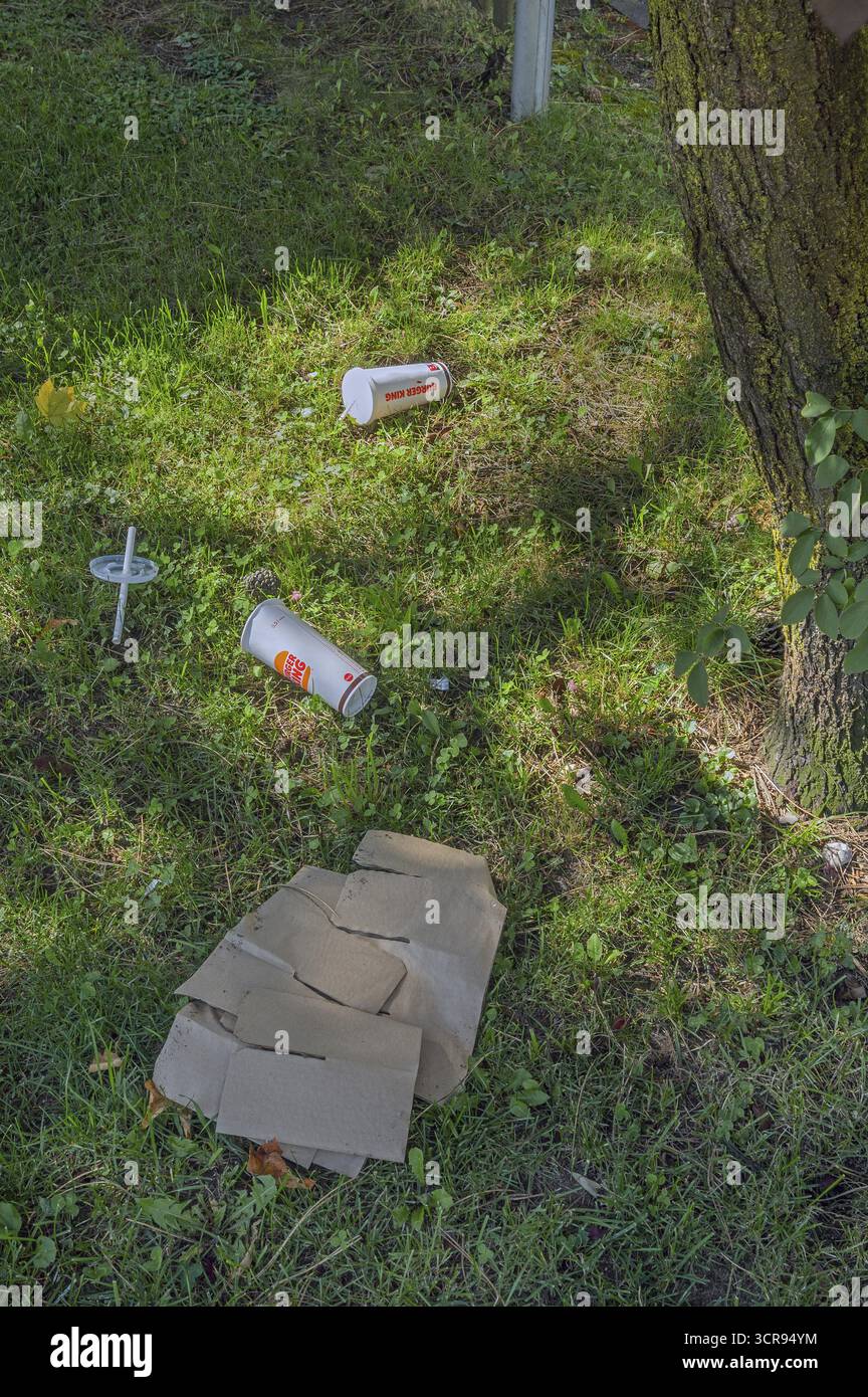 Lawn with waste from Burger-King food, Kempten, Allgaeu, Swabia, Germany Stock Photo