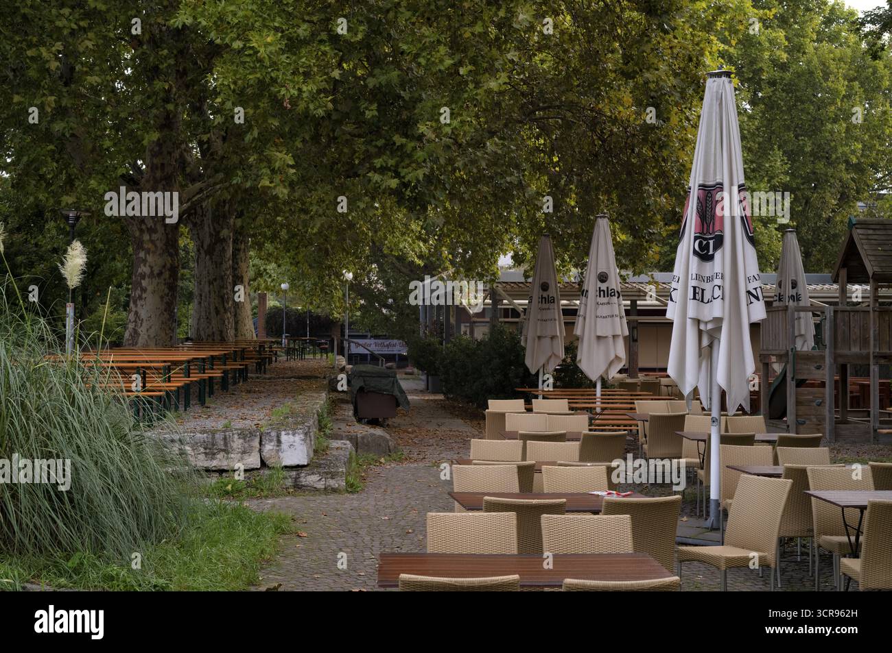 Beer garden on the Neckar, Neckar beer garden, empty, closed, Dinkelacker logo, Bad Cannstatt, Stuttgart, Baden-Wuerttemberg, Germany Stock Photo