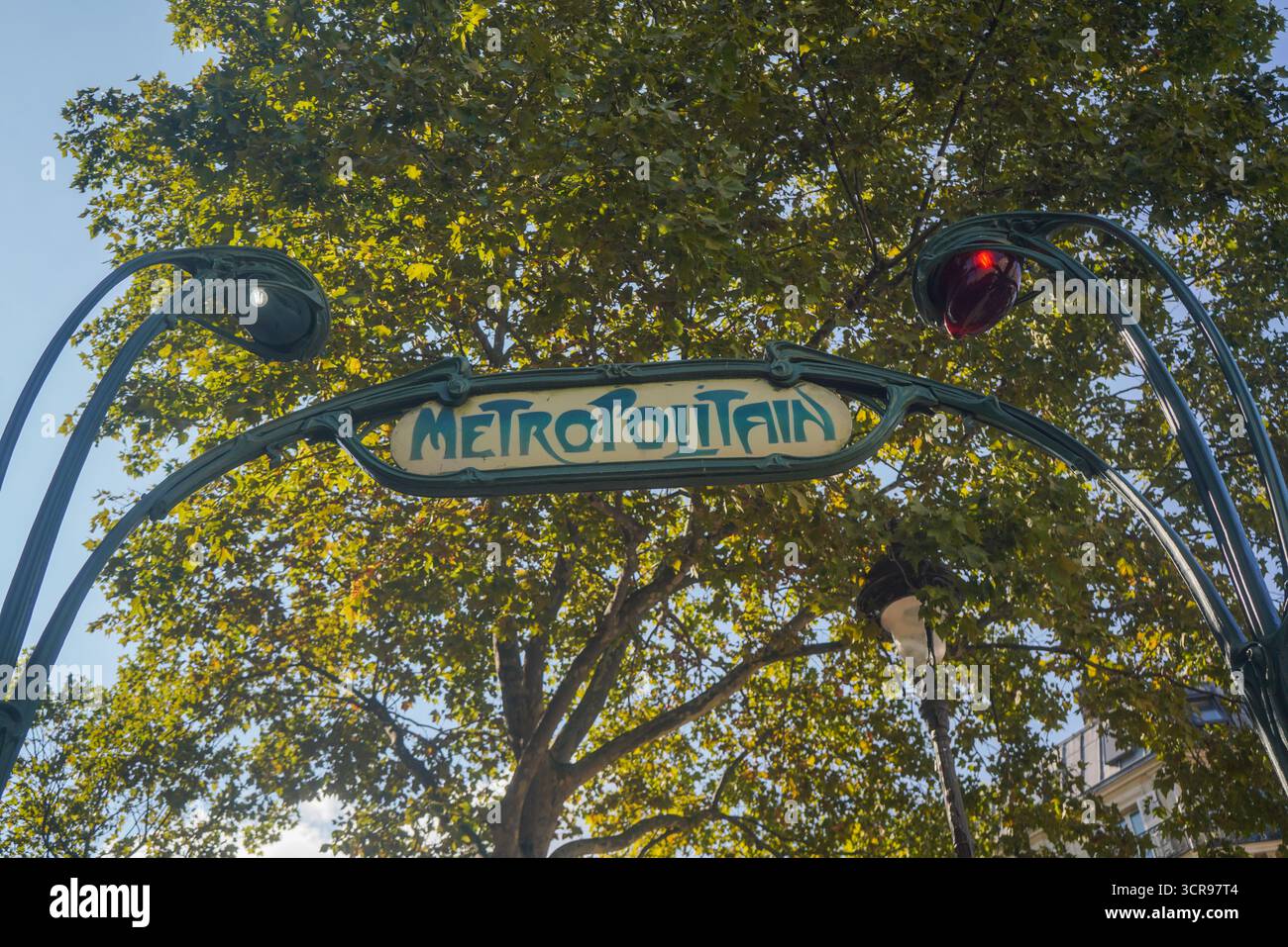 Art Nouveau Métropolitain sign, designed by Hector Guimard, above Gare ...