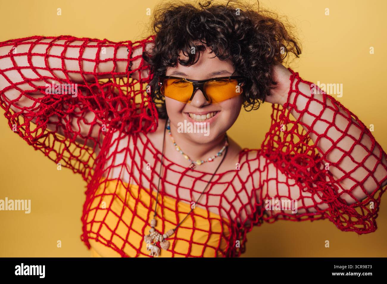 Red fishnet dress hi-res stock photography and images - Alamy