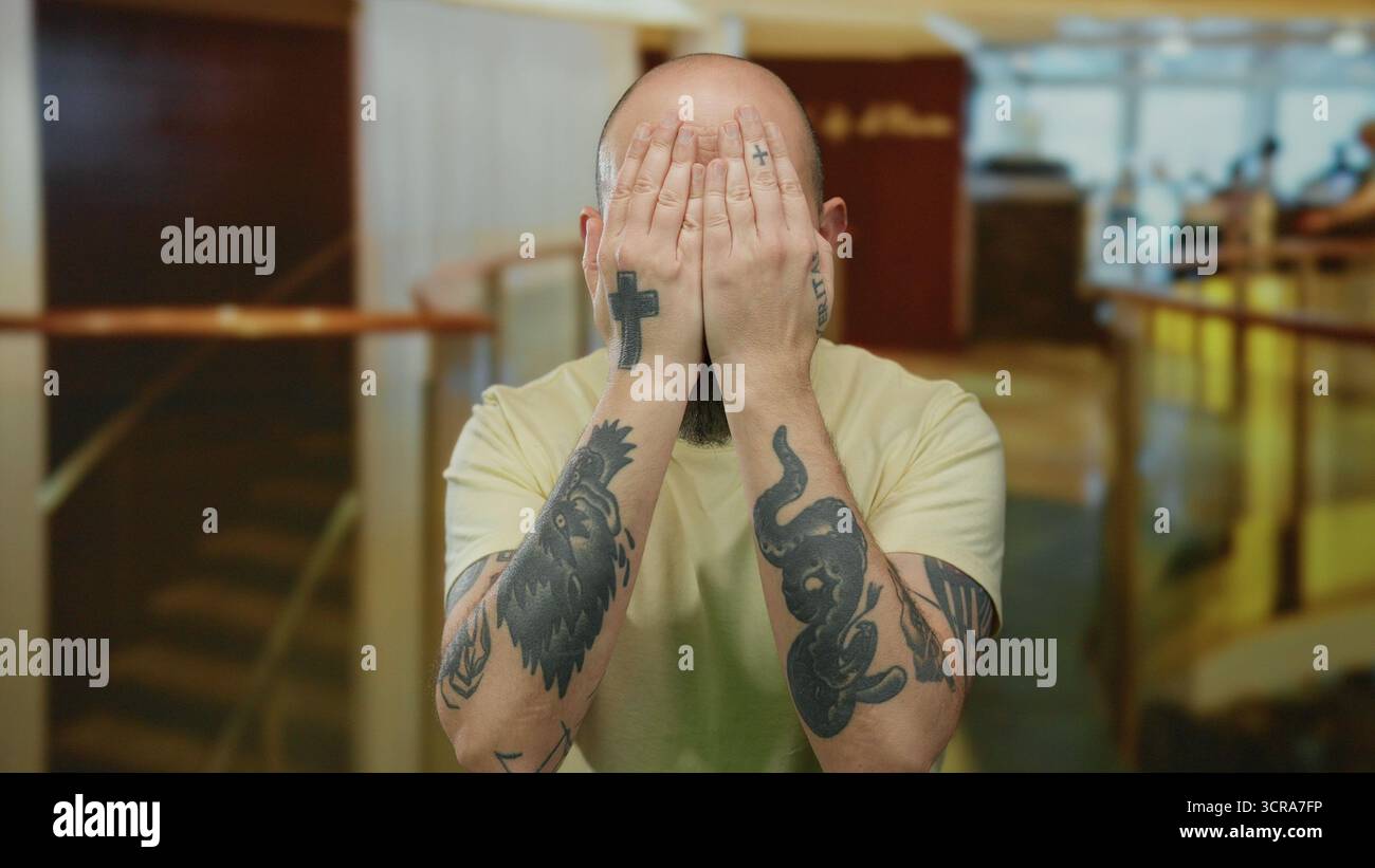 Man tattoos playfully covering hi-res stock photography and images - Alamy