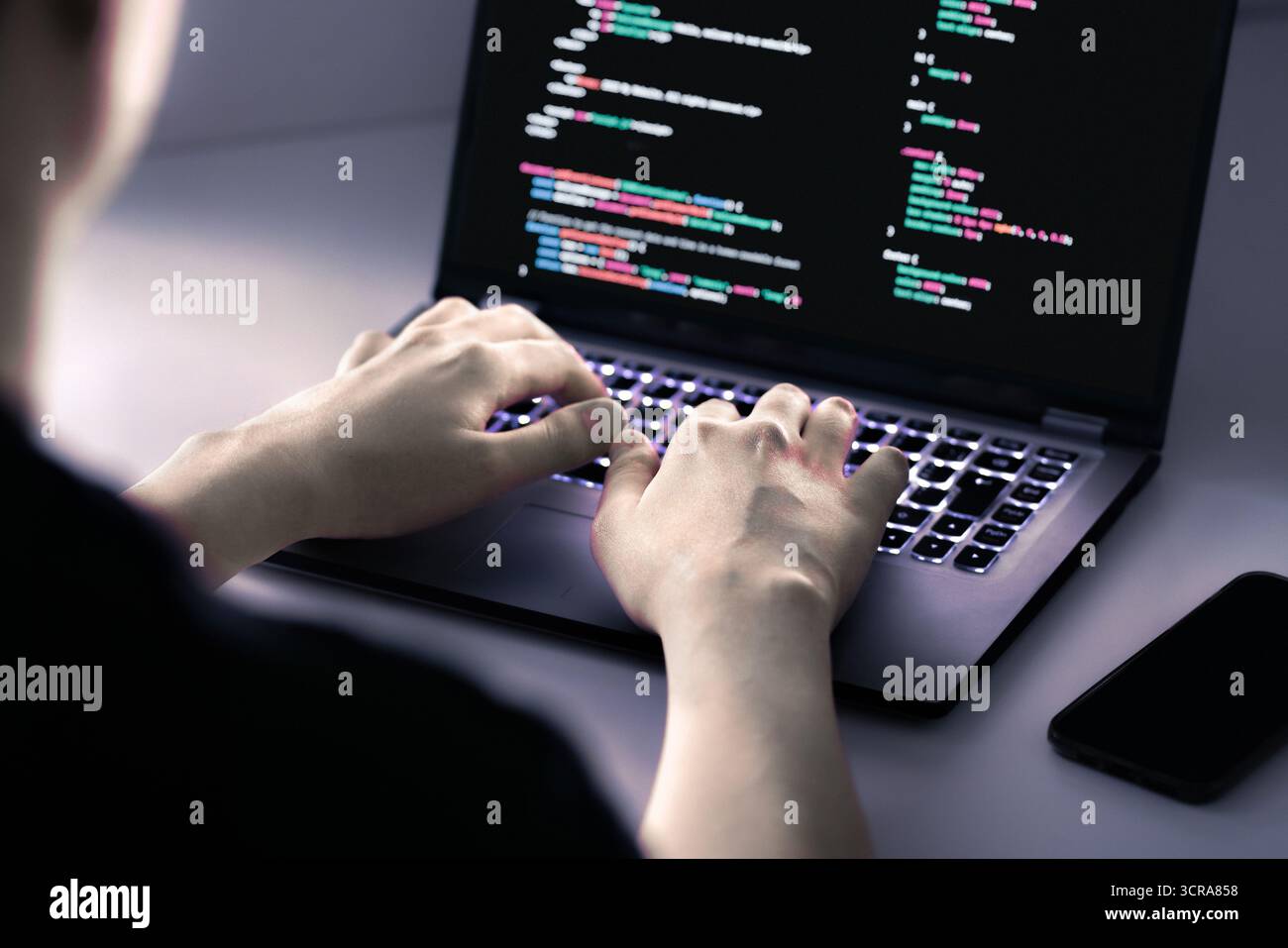 Hacker software in computer. Cybersecurity from malware, ransomware or spyware attack. Develop data on screen. Fraud or breach code in laptop. Stock Photo