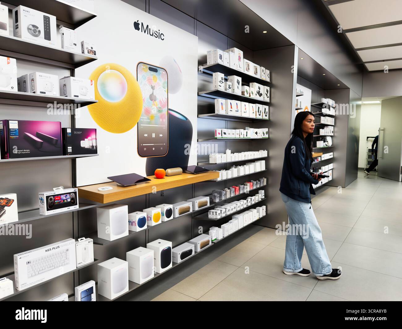 Manchester, UK - September 29, 2025: A shopper explores a bright tech ...