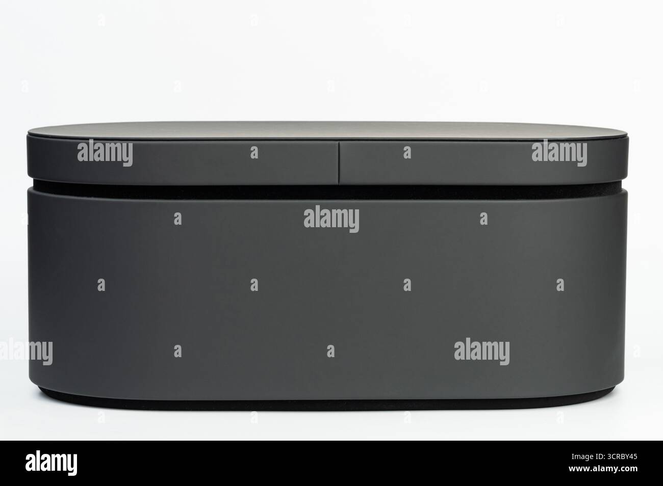 Black oval box side view isolated on white studio background Stock Photo