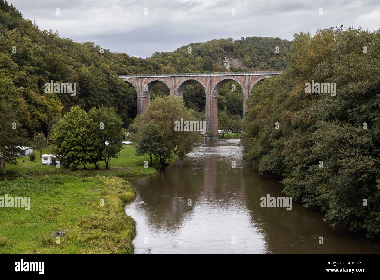 Early autumn view of the 19th century 40m high Conques Viaduct as it crosses the Semois River near Herbeumont in the Ardennes Region of Belgium. Copy - Stock Image