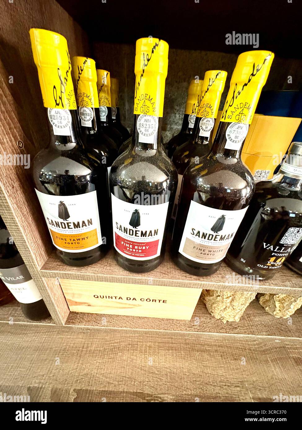 Sandeman port bottles, fine ruby port and fine tawny port bottles on display in a Portuguese restaurant,Portugal,Europe - Smartphone Captured Stock Image