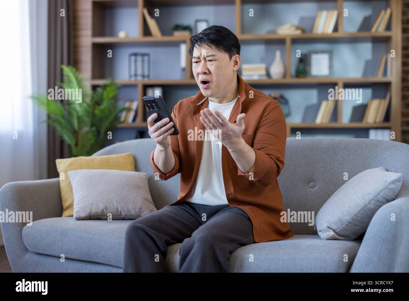 Adult asian man receiving bad hi-res stock photography and images - Alamy