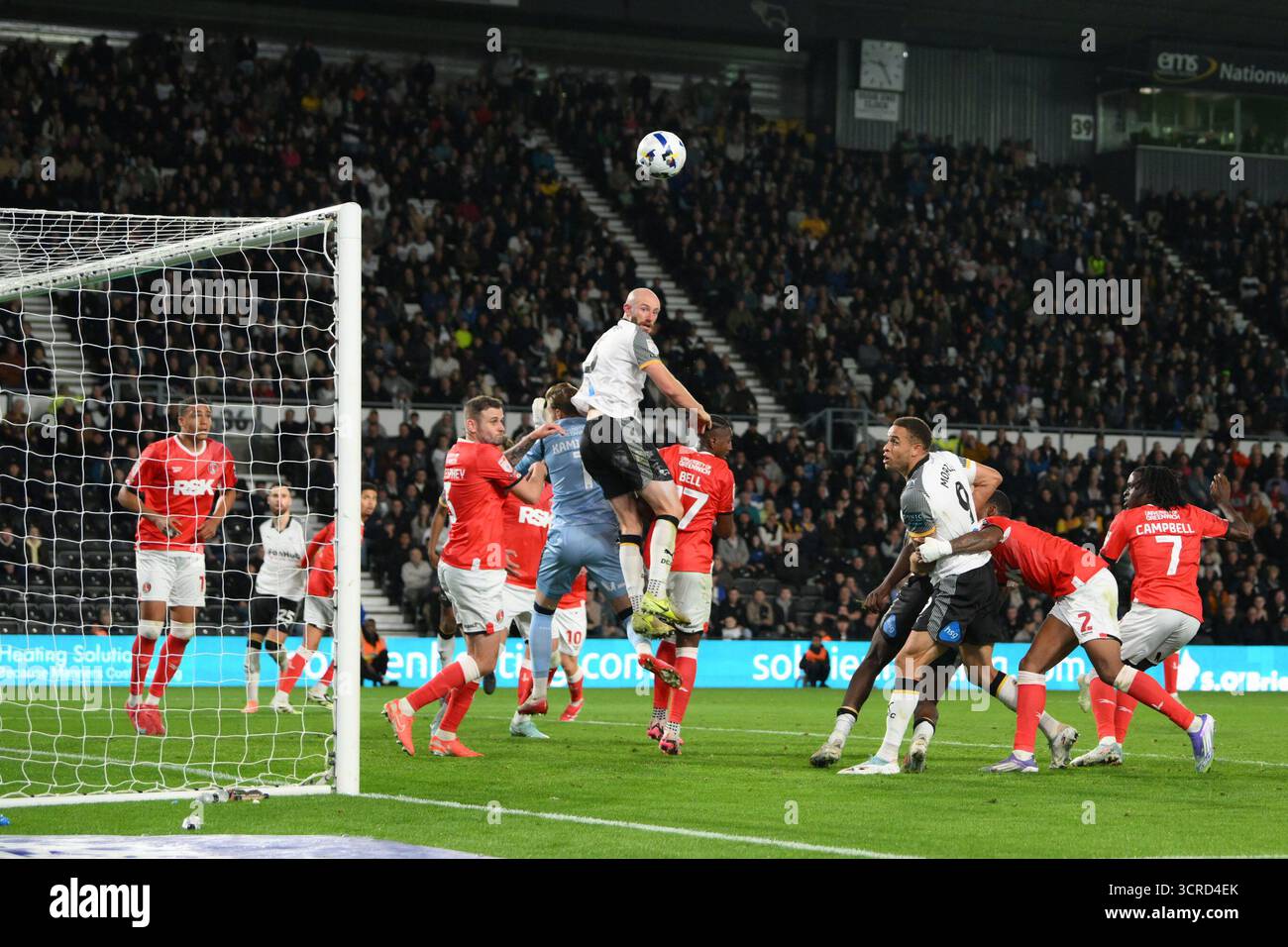 Derby County and Charlton Athletic players battle for the ball during ...