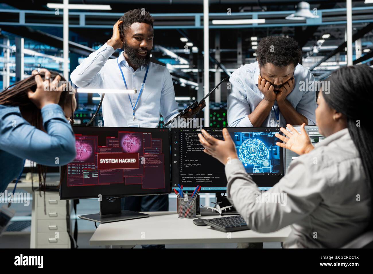 Data center technicians using artificial intelligence computerized model panicking after virus attack warning. Server room coworkers scared by hacking attempt on systems while using AI algorithms Stock Photo