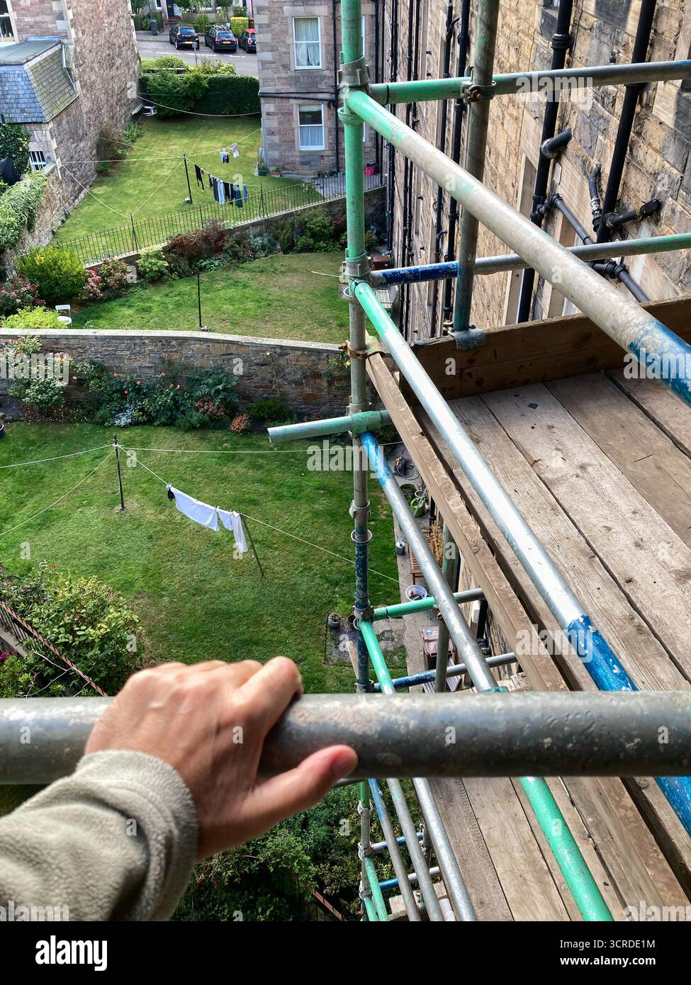Scaffold tower in place for Communal Roof repairs access on an Edinburgh tenement, UK - Smartphone Captured Stock Image