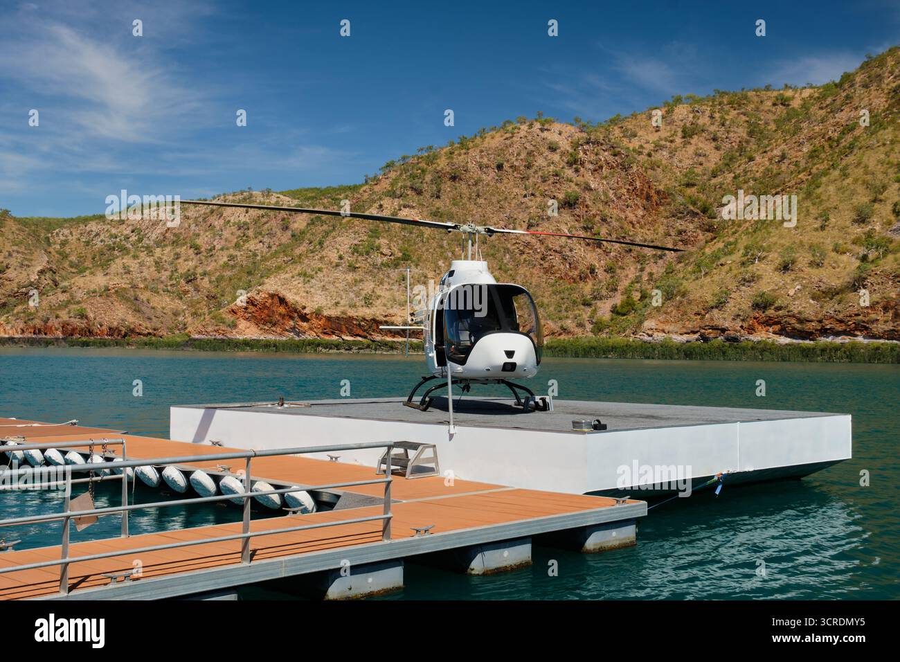 Small helicopter on the helipad waiting for tourists - Talbot Bay, WA, Australia Stock Photo