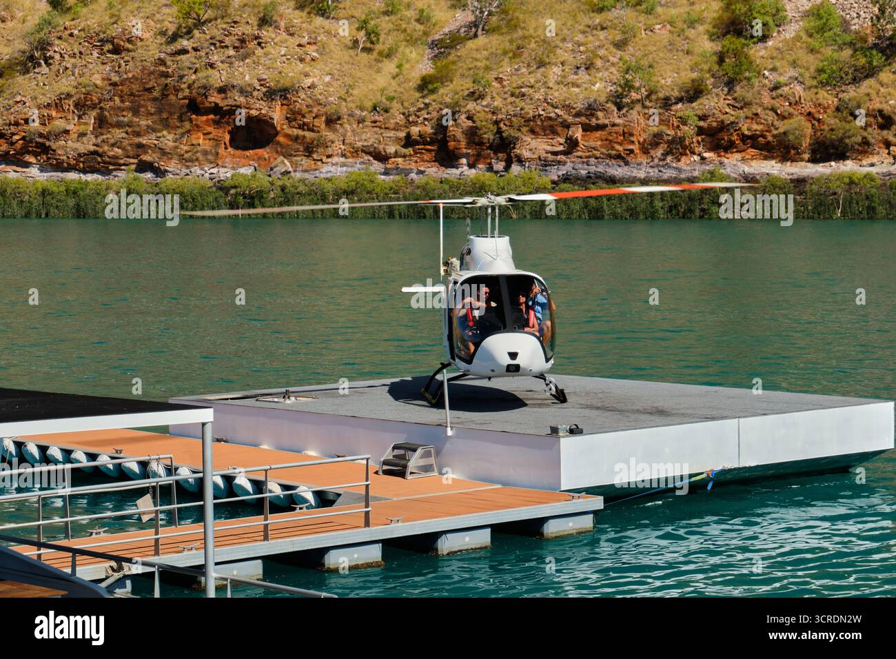 Tourists can board a helicopter for a low-level fly over the bay - Talbot Bay, WA, Australia Stock Photo