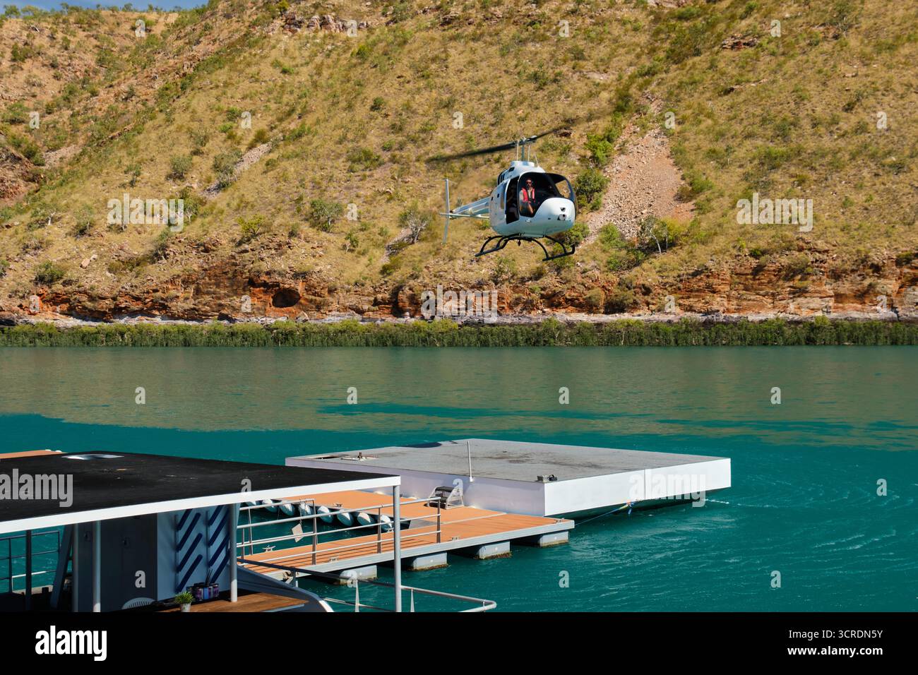 Tourists can board a helicopter for a low-level fly over the bay - Talbot Bay, WA, Australia Stock Photo