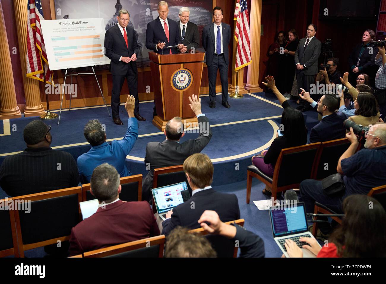 Senate Majority Leader John Thune, R-S.D., center, speaks to reporters ...