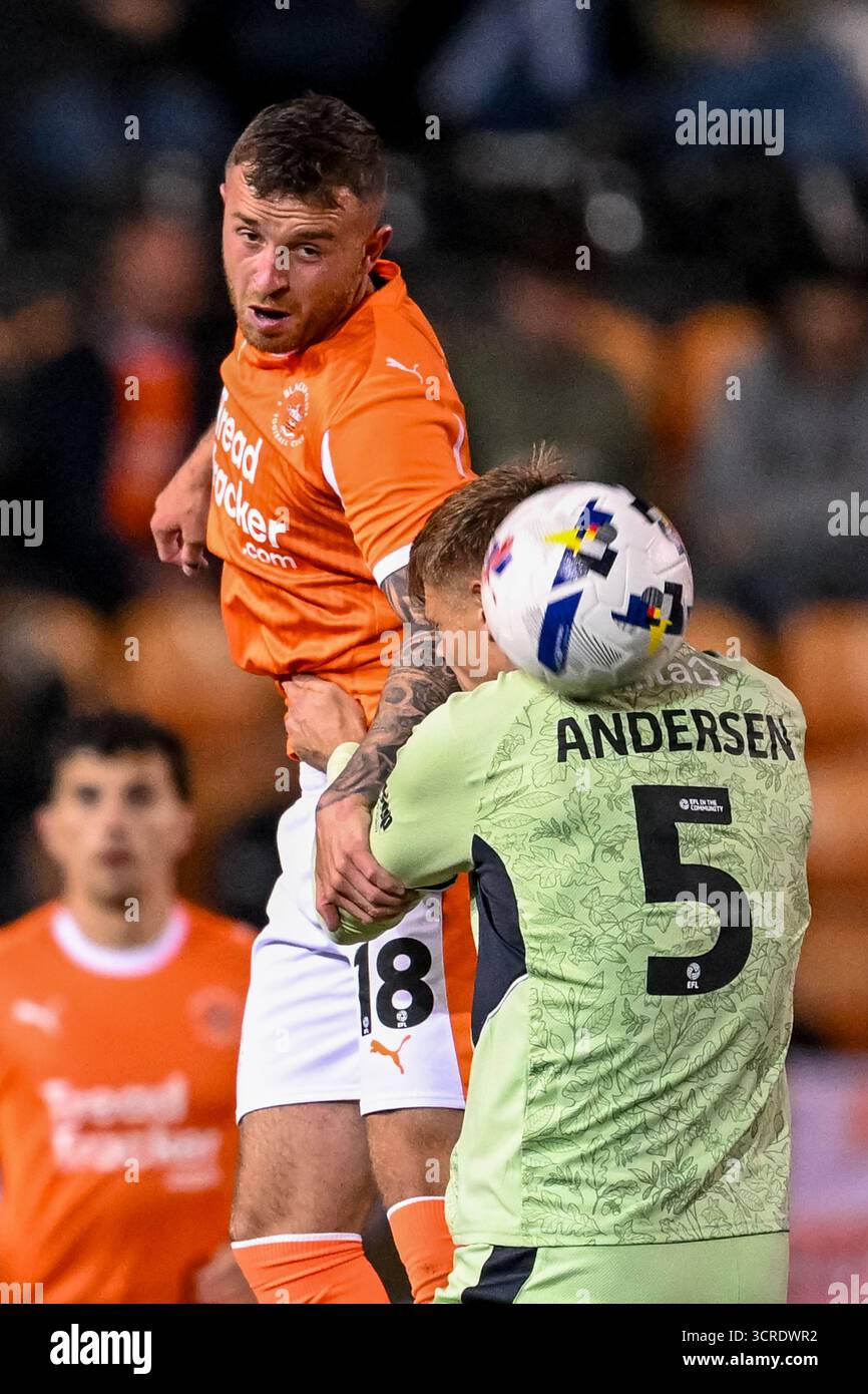 Blackpool, UK. 30th Sep, 2025. Dale Taylor of Blackpool heads the ball past Mads Juel Andersen of Luton Town during the Sky Bet League 1 match Blackpool vs Luton Town at Bloomfield Road, Blackpool, United Kingdom, 30th September 2025 (Photo by Adam Gee/News Images) in Blackpool, United Kingdom on 9/30/2025. (Photo by Adam Gee/News Images/Sipa USA) Credit: Sipa USA/17�Թ����� Live News Stock Photo