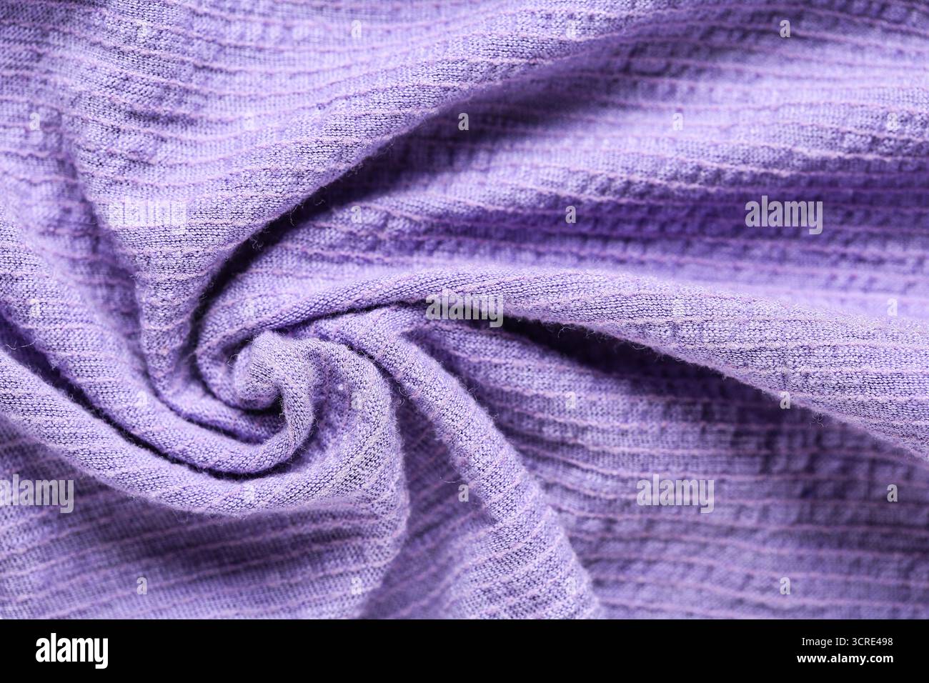 Crumpled violet muslin as background, closeup Stock Photo