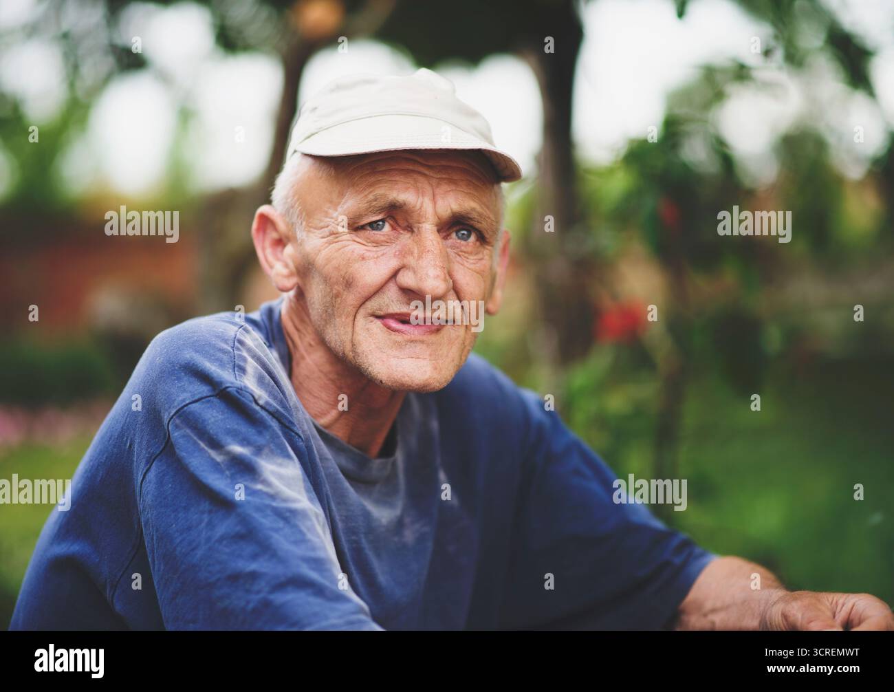 Senior man with gray hair 60-65 year old over nature background close up. Mature lifestyle. Stock Photo