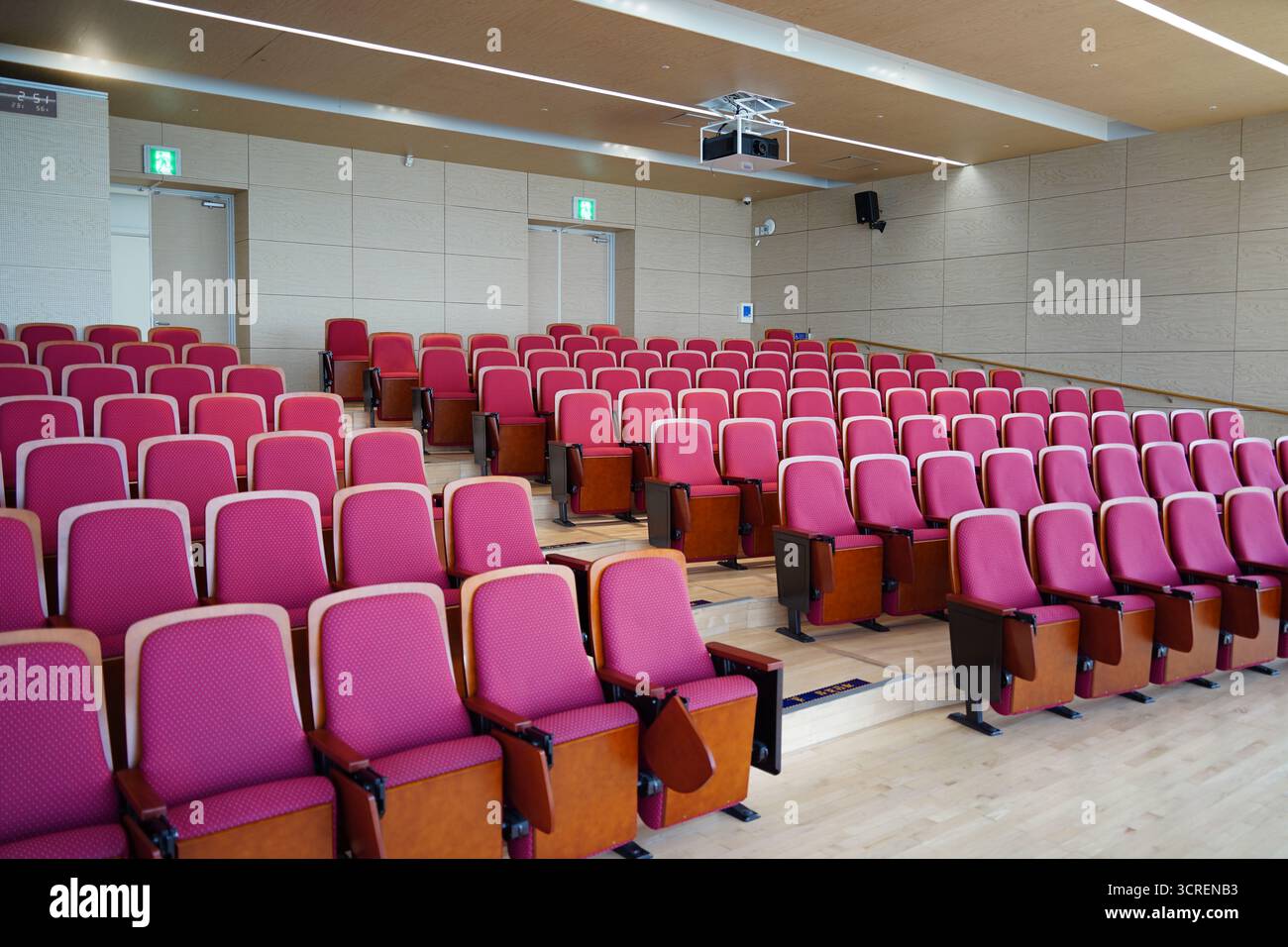 Empty Conference Hall Auditorium with Red Chairs Stock Photo