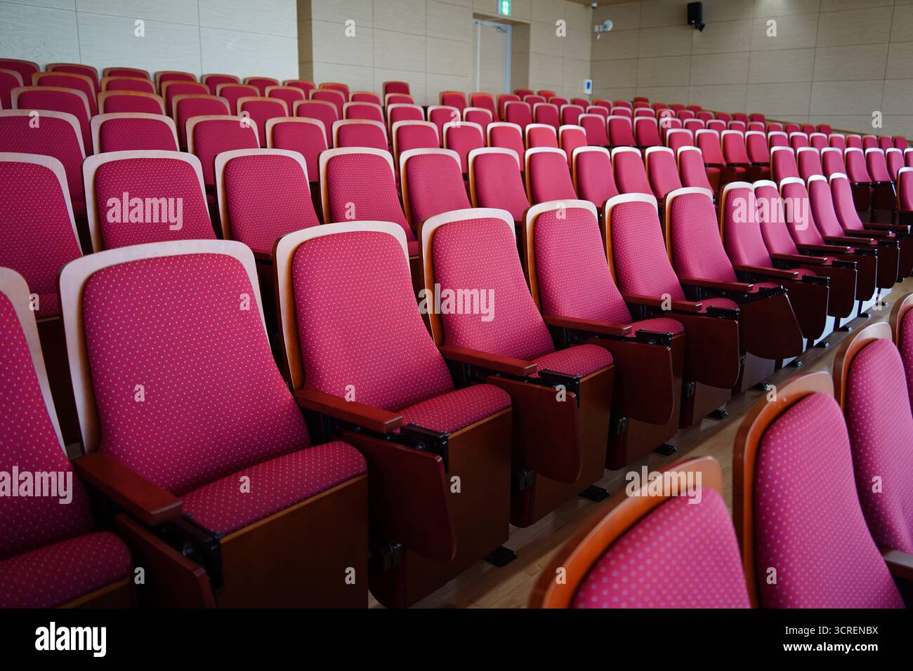 Empty Conference Hall Auditorium with Red Chairs Stock Photo